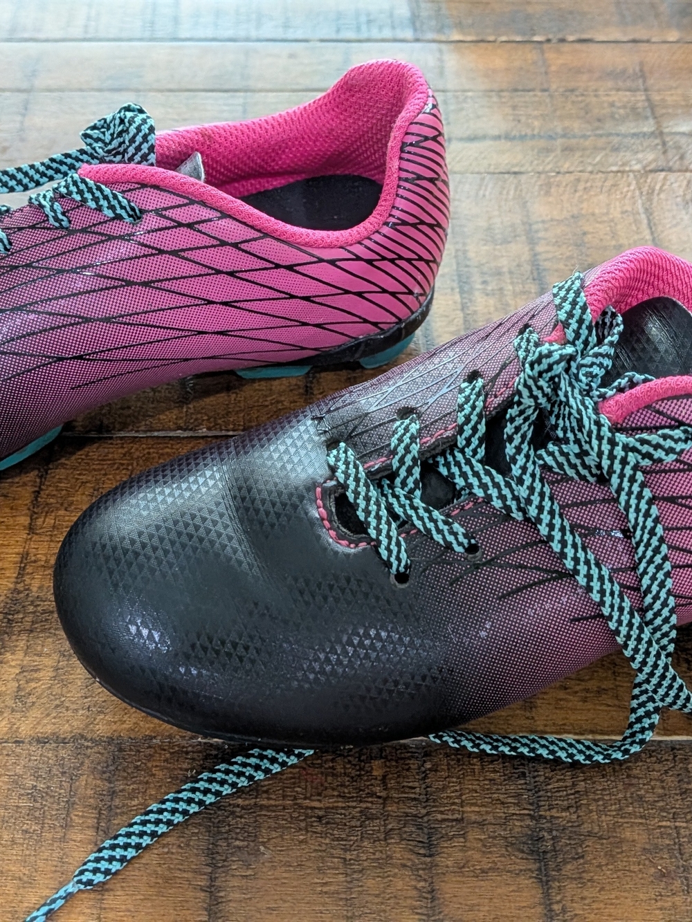 DSG Pink and Black Kids Soccer Cleats with Teal Accent Laces - Picture 4 of 5